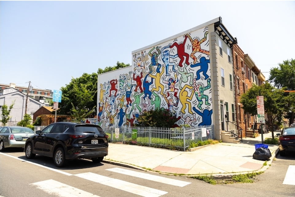 Point Breeze block with new-construction townhomes beside traditional row homes